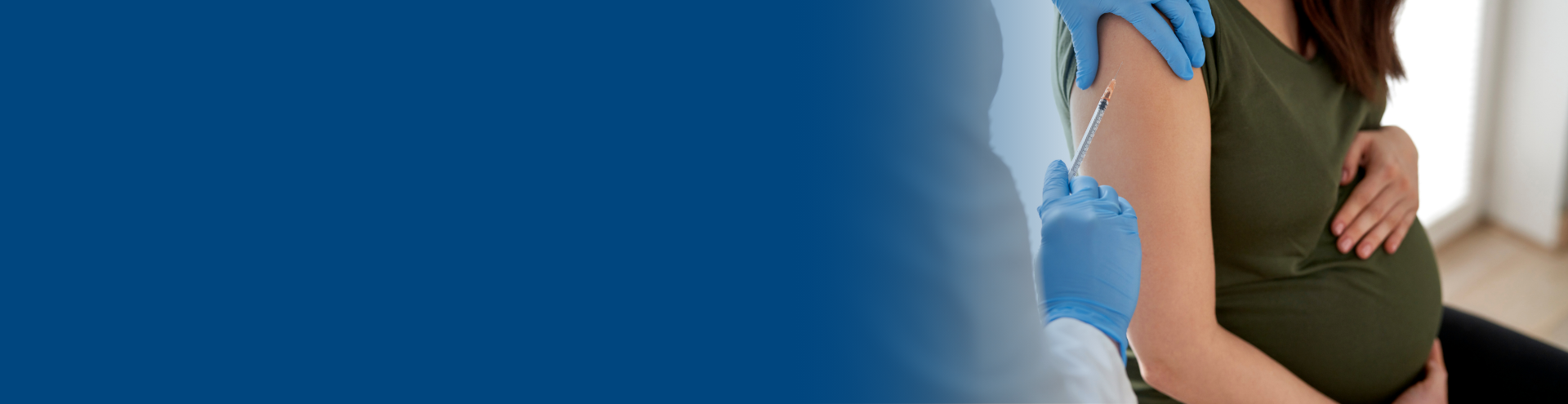 Pregnant woman receives vaccination in arm