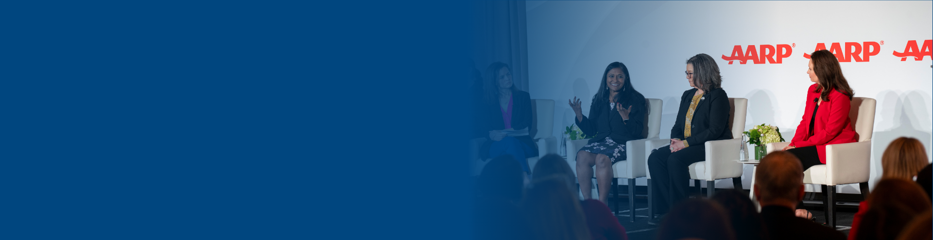 Speakers on stage at the AARP conference